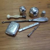 A mixed lot of silver including a 19thc ivory handled white metal seal in the form of clenched