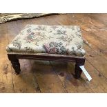 A small Victorian mahogany footstool, the upholstered top on tapering legs (19 x 36 x 27)