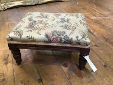 A small Victorian mahogany footstool, the upholstered top on tapering legs (19 x 36 x 27)