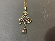 A 9ct gold amethyst set lady's pendant on a yellow metal chain marked 925 (3.4g)