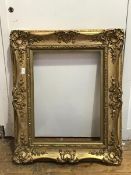 A Victorian ornately moulded gilt frame (internal: 45cm x 61cm)