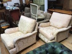 A pair of modern 'Landsdowne' easy chairs, upholstered in gold damask, raised on turned legs and