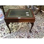 A mahogany cutlery canteen in the form of a coffee table in the 19thc style with leather inset