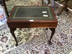 A mahogany cutlery canteen in the form of a coffee table in the 19thc style with leather inset