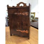 An Edwardian Arts and Crafts oak pipesmokers' cabinet, the rectangular top with ledgeback, fitted