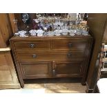 An Edwardian mahogany and chequer-banded chest, fitted with three drawers and a pair of cupboards,