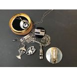 A mixed lot of white metal and silver jewellery including a circular white metal brooch/pendant, a