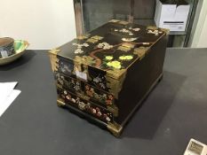 A Chinese travelling mahogany jewellery box with brass fittings, with floral painted decoration, the