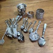 A mixed lot of silver and white metal including flatware, a small silver bowl, napkin rings etc. (