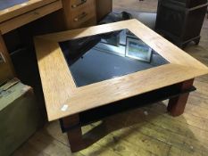 A modern oak and painted low table, the glass top above a central velvet-lined recess, on square