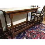 An Arts & Crafts oak side table in the manner of Edwin Lutyens, of refectory table form, the solid