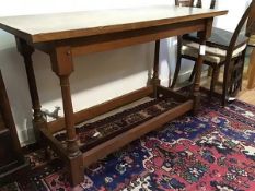 An Arts & Crafts oak side table in the manner of Edwin Lutyens, of refectory table form, the solid