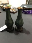 A pair of Chinese small baluster lacquered wood vases with celadon green decoration on stands (