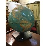 A Mid Century terrestrial wooden mounted desktop globe (h.51cm x 45cm)