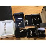 A mixed lot of silver jewellery including a Celtic cross, brooches, Mackintosh style earrings and