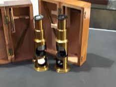 Two 19thc/20thc brass cased pocket microscopes, in fitted wooden boxes