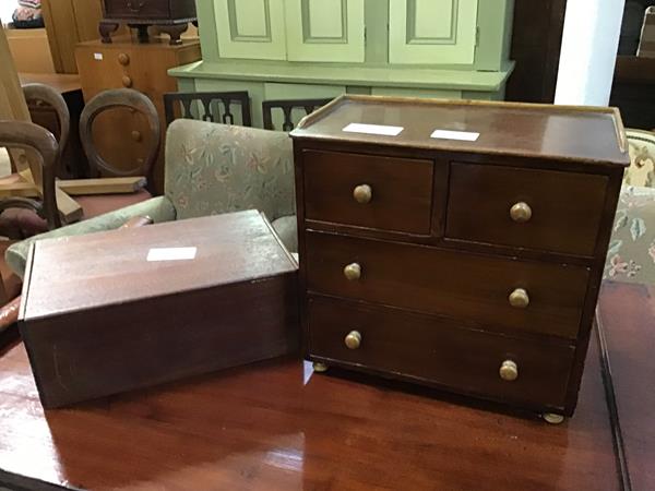 A 19thc style miniature chest of drawers, the rectangular top with ledge back, fitted two short