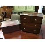 A 19thc style miniature chest of drawers, the rectangular top with ledge back, fitted two short