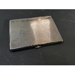 A hallmarked silver cigarette case with engine turned decoration (5.7oz)