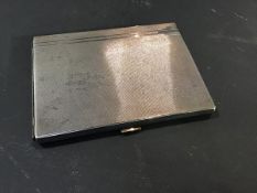 A hallmarked silver cigarette case with engine turned decoration (5.7oz)