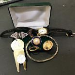 A mixed lot including a silver two piece money clip, a Scottish silver brooch, a bangle, watch