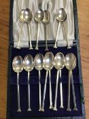 A set of ten and a set of six seal terminal silver coffee spoons, different dates (5oz)