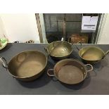 A group of four 20thc twin handled Indian Balti style brass and copper cooking pots (largest: d.