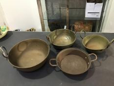 A group of four 20thc twin handled Indian Balti style brass and copper cooking pots (largest: d.