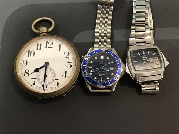 A mixed lot of watches including an oversized pocket watch, a Seiko stainless steel vintage