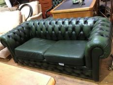 A modern leather Chesterfield sofa bed, with button upholstery (69 x 185 x 88cm)