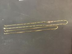 A 9ct gold chain together with a yellow metal chain, marked 9ct (2) (10g)