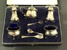 A cased silver five piece condiment set (losses)