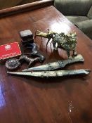 A mixed lot consisting of a cast brass Chinese dog of Fou, a group of Middle Eastern daggers,