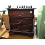 A small modern chest of three drawers, raised on bracket feet (55 x 50 x 33)