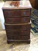 A small mid-20th century bowfront chest of five graduated drawers, on bracket feet (73.5 x 41cm x