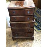 A small mid-20th century bowfront chest of five graduated drawers, on bracket feet (73.5 x 41cm x