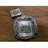 A Continental embossed white metal ashtray depicting a Dutch style tavern scene together with a