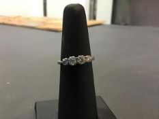 A four stone diamond engagement ring on 18ct gold shank (M/L) (2.13g)