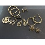 A mixed lot of lady's hoop earrings and drop earrings, mainly hallmarked 9ct (total weight 19.6g)