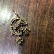 A Russian gold peridot set open work pendant, stones missing (4.6g)