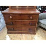 A small Victorian mahogany chest of three long drawers, raised on a plinth base (81 x 104 x 56cm)