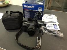 An Olympus C-8080 wide zoom digital compact camera with carry case and original box, complete with