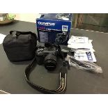 An Olympus C-8080 wide zoom digital compact camera with carry case and original box, complete with