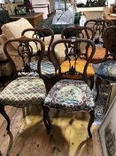 A set of six Victorian rosewood side chairs, each with moulded back and pierced splat, above