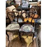 A set of six Victorian rosewood side chairs, each with moulded back and pierced splat, above