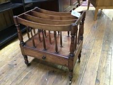 A 19thc mahogany canterbury, fitted four sections, raised on turned supports (one spindle