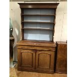 A Victorian mahogany two part dresser, the converted open top with moulded cornice, fitted three