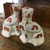 A pair of Arthur Wood Staffordshire chimney Spaniels. (h.23cm)