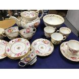 A 19thc handpainted floral decorated and gilded part teaset, comprising sugar bowl, cups and saucers