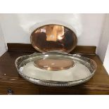A silver plated oval gallery tray, on four feet, one loose but present, together with a copper